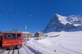 Jungfrau railway train station at Kleine Scheidegg to Jungfraujoch, north face of mount Eiger in background, Switzerland Royalty Free Stock Photo
