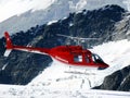 Jungfrau, Switzerlan, 08/06/2009. Red helicopter on high mountai