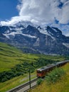 Jungfrau, Switzerland - August 19, 2019: Beautiful view of the Alpine valley in the Jungfrau region. Train from Lauterbrunnen