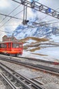 Railway station with swiss train and mountains in Jungfrau, Switzerland.