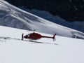 Jungfrau, Switzerland. 08/06/2009. Red colored helicopter and ma