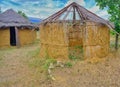 Jungle bamboo houses with their roofs made of plant or tree branches Royalty Free Stock Photo