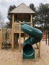 Jungle gym with covered sliding board in local park Royalty Free Stock Photo