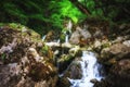 Jungle landscape with flowing turquoise water of georgian cascade waterfall at deep green forest. Mountain of georgia Royalty Free Stock Photo