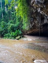 Jungle rain forest water river inside entry exit stalactite cave green trees lianes rocks north chiang mai in pai tour