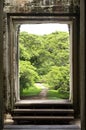 Jungle thet can be seen through the doorway in Angkor wat Royalty Free Stock Photo