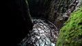 Jungle to a cliff on a high mountain with a rock river and green trees