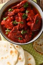 Junglee Maas is a rich, dark red, spicy goat meat curry thatÃ¢â¬â¢s slow cooked to attain the best complex flavors closeup. Vertical