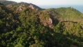 Jungles and mountains of tropical island. Drone view of green jungles and huge boulders on volcanic rocky terrain of Koh Tao Royalty Free Stock Photo