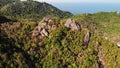 Jungles and mountains of tropical island. Drone view of green jungles and huge boulders on volcanic rocky terrain of Koh Tao Royalty Free Stock Photo