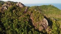 Jungles and mountains of tropical island. Drone view of green jungles and huge boulders on volcanic rocky terrain of Koh Tao Royalty Free Stock Photo