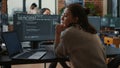 Junior developer putting laptop with source code on senior dev desk asking for opinion