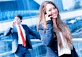 Junior executive dynamic phoning outside of her office Royalty Free Stock Photo