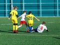 Junior football match. Soccer game for youth players. Boys in blue and white uniform playing soccer match. Football stadium