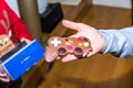 Junior hand holding gift chocolate game console controller Royalty Free Stock Photo