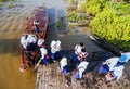 Junior High School Students using a traditional boat to go to their school in Banjarmasin, Indonesia.