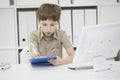 Junior school student does his homework. Royalty Free Stock Photo