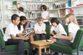 Junior school students working in a library Royalty Free Stock Photo