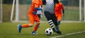 Junior Soccer Match Duel. Football Game For Youth Players. Boys Playing Soccer Match on Football Pitch Royalty Free Stock Photo