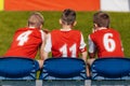 Junior Soccer Players Sitting on Football Soccer Team Bench