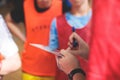 Junior young basketball team with a coach, group of kids children team having training and team talk speach with trainer Royalty Free Stock Photo