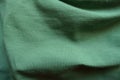 green cotton fabric in soft folds Royalty Free Stock Photo