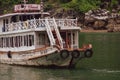 Junk boat berthing in Ha Long Bay, Vietnam near Surprise Cave Royalty Free Stock Photo