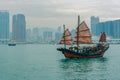 Junk boat with red sails on Victoria Harbor, Hong Kong Royalty Free Stock Photo