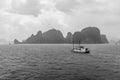 Junk boat sailing across Ha Long Bay, Vietnam Royalty Free Stock Photo