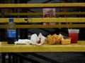 Junk Food Feast on Bleacher Bench