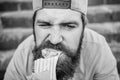 Junk food. Snack for good mood. Unleashed appetite. Street food concept. Man bearded eat tasty sausage. Urban lifestyle Royalty Free Stock Photo