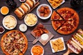 Junk food table scene, overhead view on dark wood Royalty Free Stock Photo