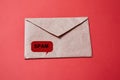 Junk mail or spam and fake letter idea. Concept for unsolicited mail or e-mail. Envelope on red background Royalty Free Stock Photo