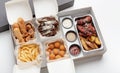 Junk meal, tasty snacks, modern fast food menu and delivery to client during covid-19 lockdown Royalty Free Stock Photo