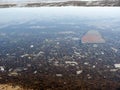 Junk on sea bottom below water surface at seaside top view Royalty Free Stock Photo