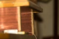 Junk tools in the garage. Antique old shelf on the wall. Used boards. Royalty Free Stock Photo