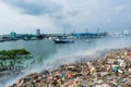 Junk yard area view full of smoke, litter, plastic bottles,rubbish and trash at the Thilafushi local tropical island Royalty Free Stock Photo