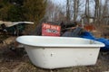 Junked bath tub