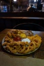 junkfood together plate with onion rings chicken wings dips