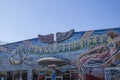 The Junkman`s Daughter store with colorful paintings on the outside of the buildings with blue sky in Little Five Points