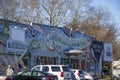 The Junkman`s Daughter store with colorful paintings on the outside of the buildings surrounded by bare winter trees