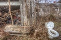 Junky yard with weeds and debris Royalty Free Stock Photo