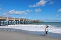 Couple Walking by Juno Beach Pier Royalty Free Stock Photo