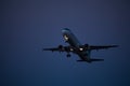 30 Juny 2016 Faro, Portugal. Passenger plane fly up over take-off runway from airport at sunset. Plane departure from airport.