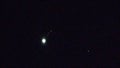 Jupiter with 4 moons, rising. plus plane.