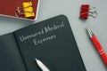 Juridical concept about Uninsured Medical Expenses with inscription on the page Royalty Free Stock Photo