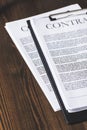 juridical contract documents on wooden table,