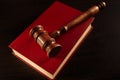 Juridical library on the table. Wooden gavel and books.