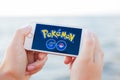 JURMALA, LATVIA - July 13, 2016: Pokemon Go logo on the phone. Pokemon Go is a location-based augmented reality mobile game.