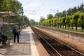 Jurmala, Latvia - May 20, 2017: People waiting for the train on the platform of railway station. Royalty Free Stock Photo